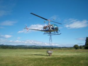 typical setup of the helicopter with the hopper underneath to distribute BTI Granules.